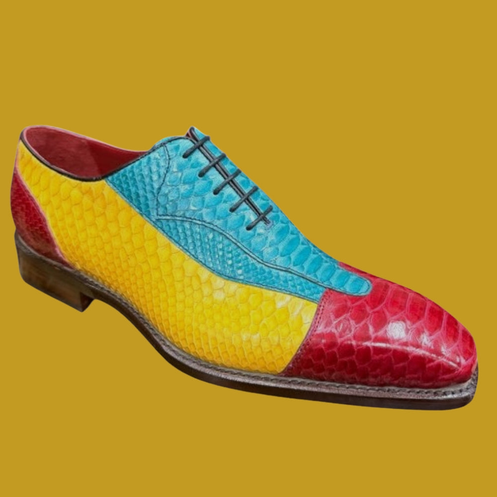 Sheriff Python dress shoes displayed on a wooden surface, featuring polished leather and sleek design for formal occasions.