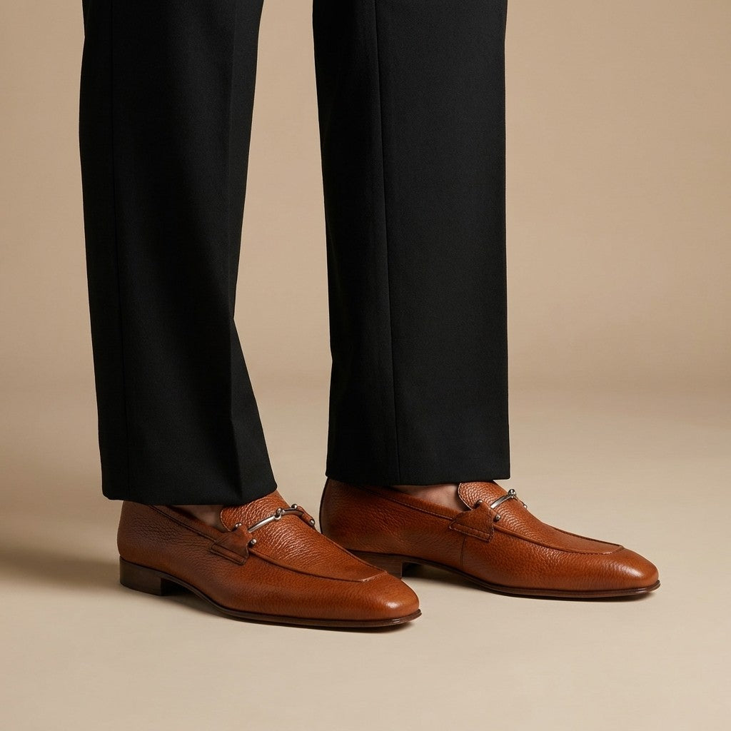 Donald Pliner Jackson tumbled calf leather loafer showing smooth, rounded toe and sleek slip-on design.