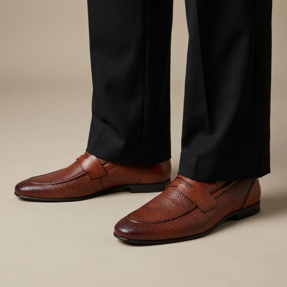 Bruno Magli Lastra woven leather loafer in brown with detailed woven pattern and sleek slip-on design.