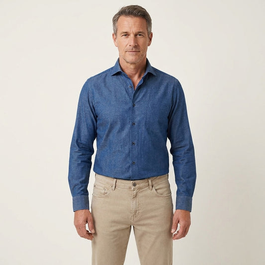 Torras blue 100% cotton shirt displayed flat, showing a classic long-sleeve design with a button-down collar and clean stitching.