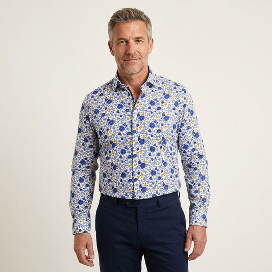 Blue Torras floral print cotton shirt with long sleeves and button front, featuring a vibrant floral pattern.