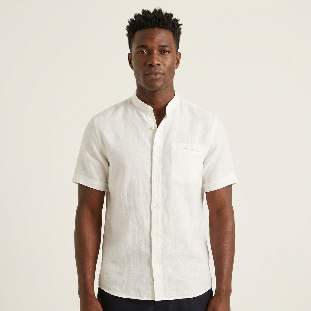 White Andrea BOSSI short sleeve linen button-up shirt displayed on a hanger, showcasing its casual and breathable design.