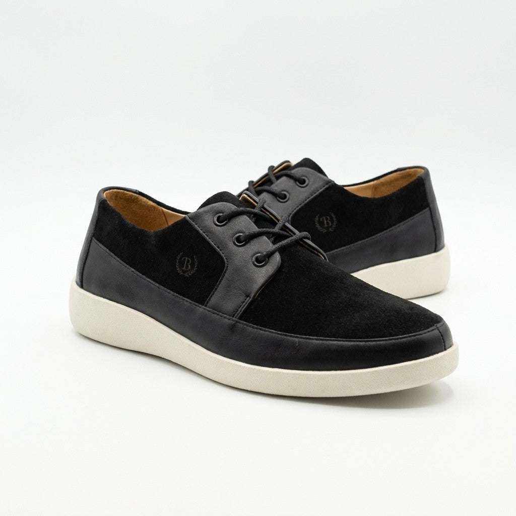 Black Johnny Famous New York Park West low top sneakers with white soles and stylish design.