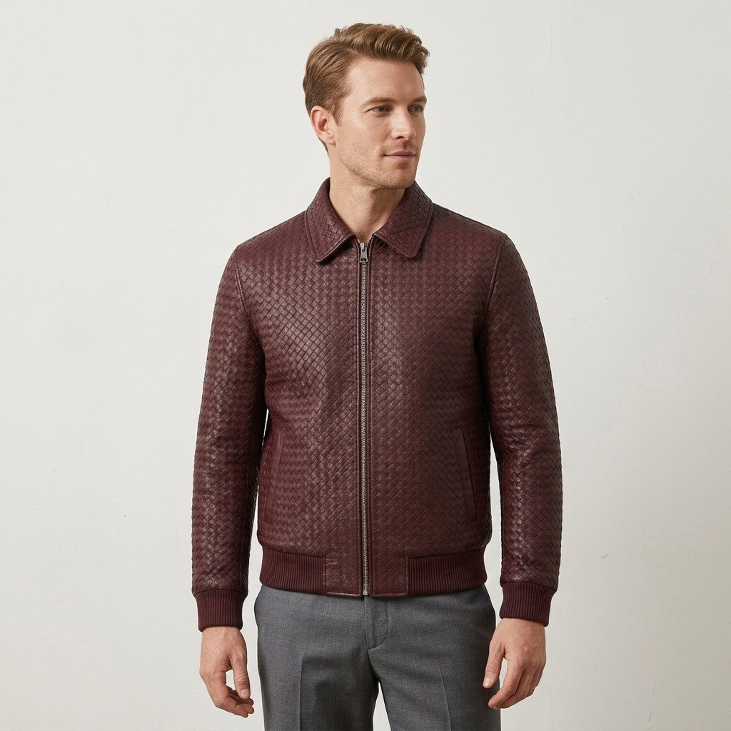 Men’s burgundy SVELG leather bomber jacket with shirt-style collar, crafted from 100% lambskin leather, shown on a hanger.