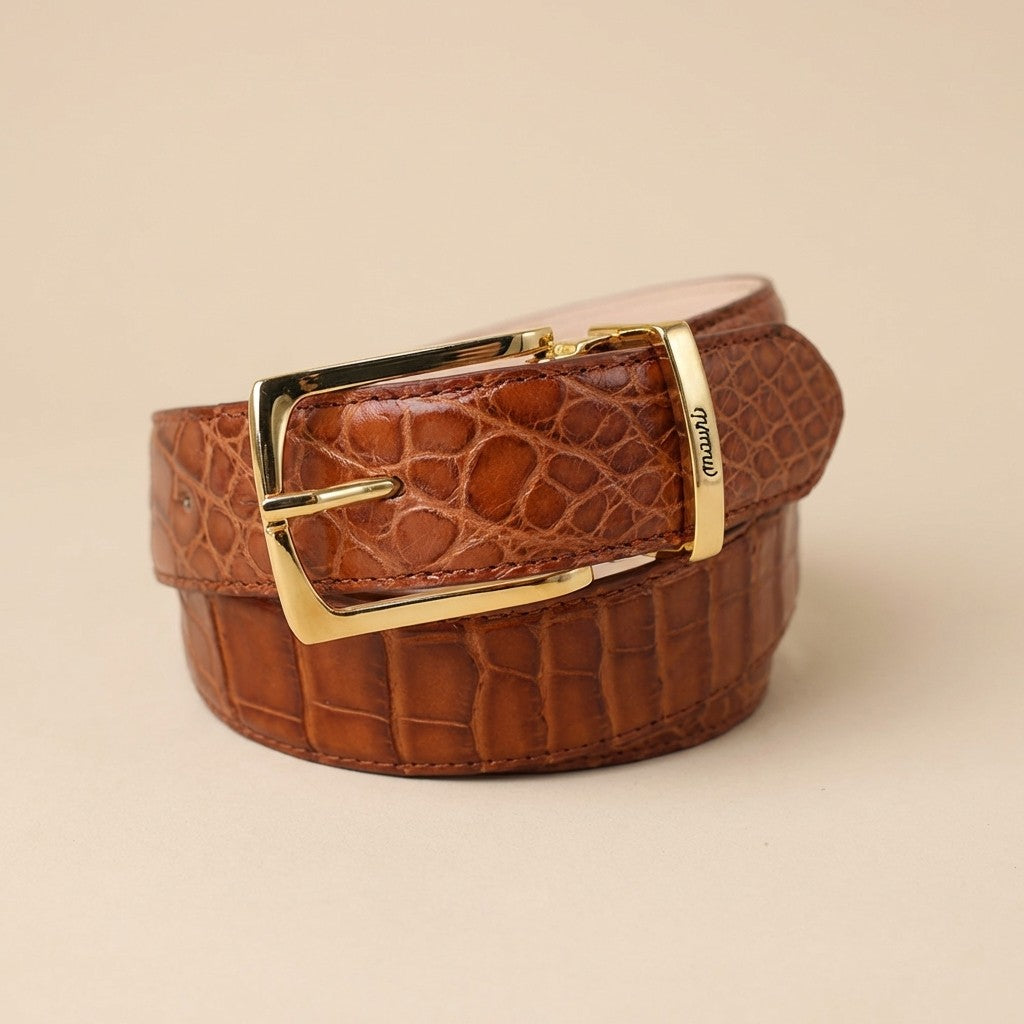 Mauri Alligator Belt featuring a sleek black leather strap and polished buckle, showcasing luxury and craftsmanship.