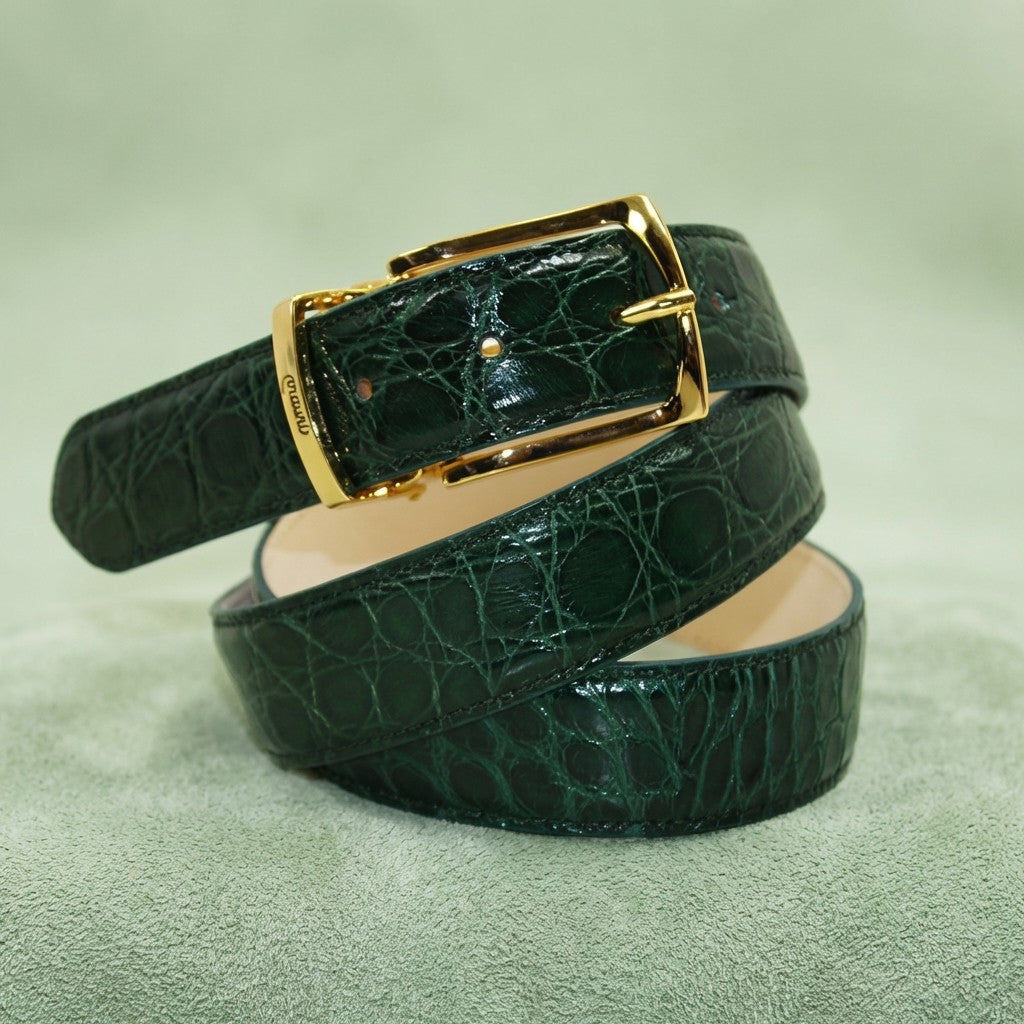 Green Mauri alligator belt with detailed textured leather and classic buckle, showcasing luxury craftsmanship.