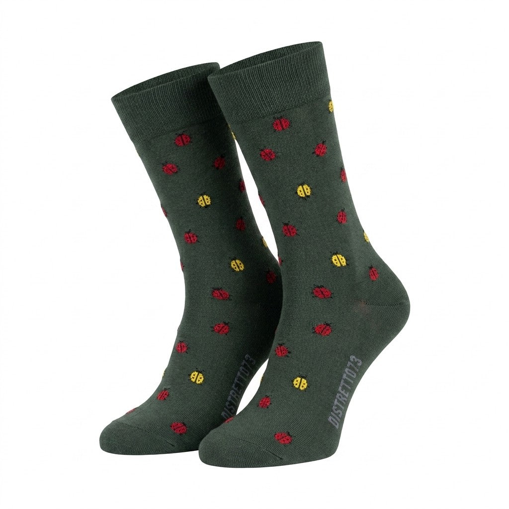 Green men's Filoscozia cotton socks with ladybug patterns from Cellini Uomo, featuring a vibrant and playful design.