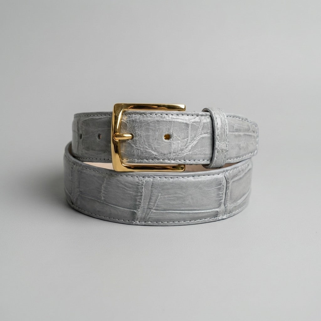 Light grey Mauri alligator belt with detailed textured finish, showcasing the luxurious leather design and classic buckle.