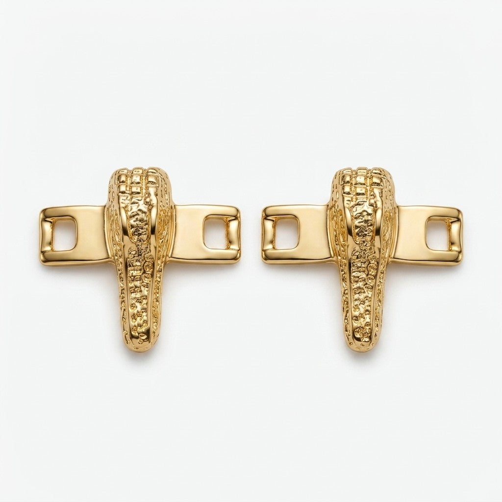 Mauri alligator shoe lace bar accessories in gold and silver with detailed textured design for footwear embellishment.