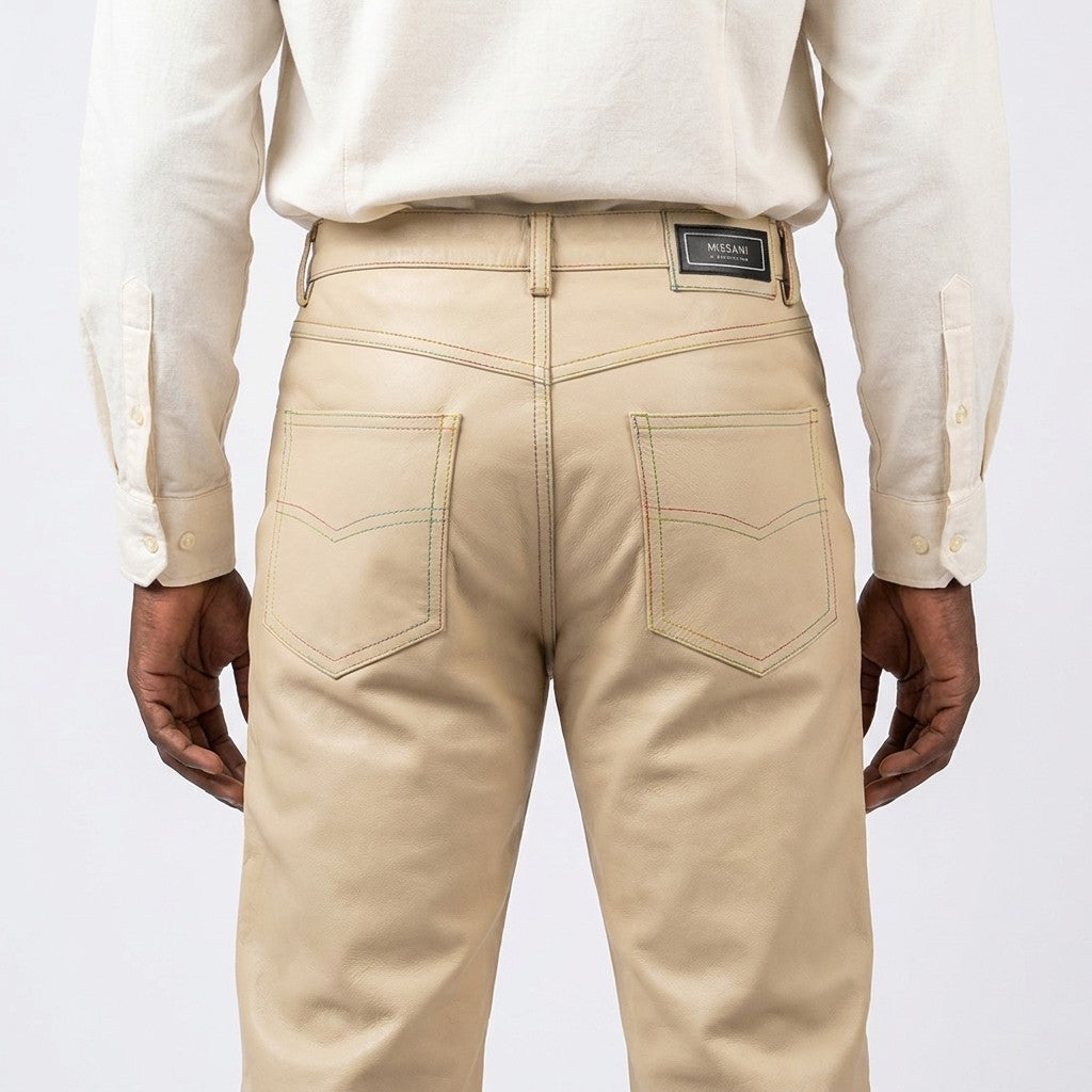 Missani 100% leather pants displayed on a hanger, showcasing sleek, fitted design and high-quality black leather material.