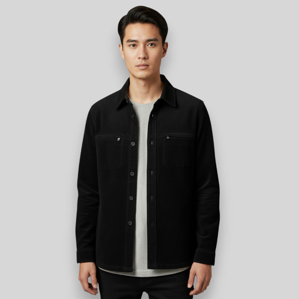 Black Missani Lamb Suede Shirt Jacket displayed on a hanger, showcasing its sleek suede texture and tailored design.