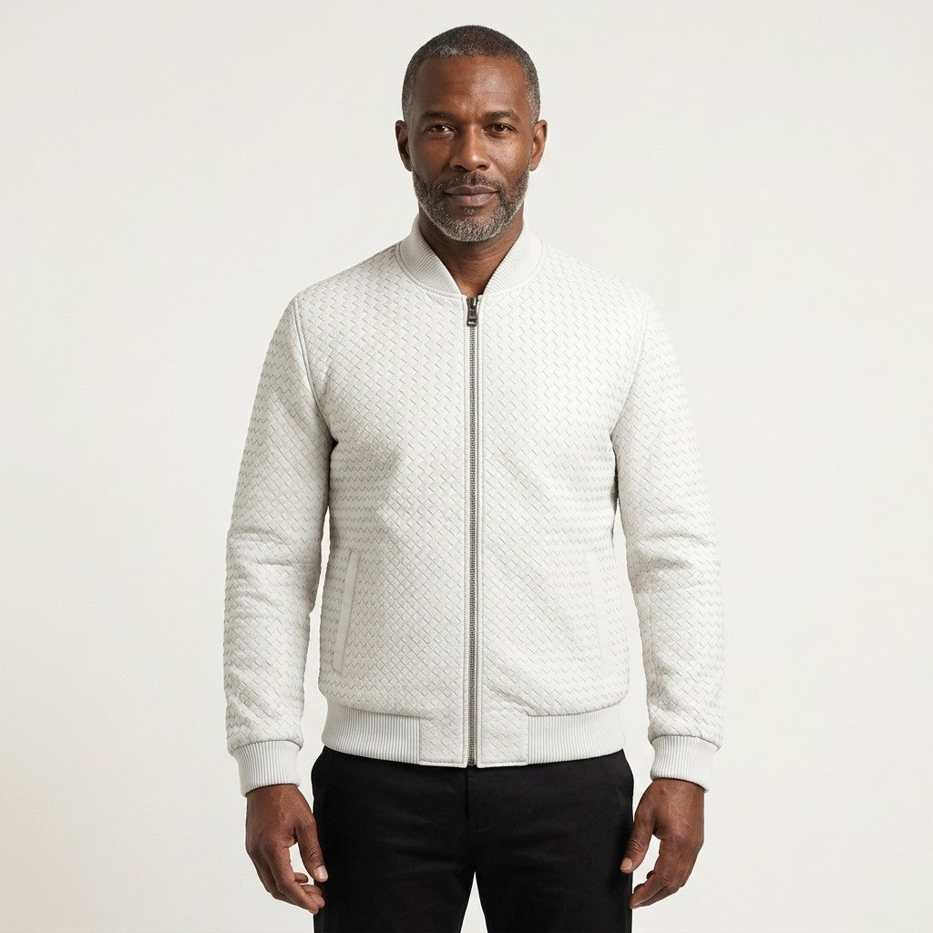 White male model wearing SVELG men's premium woven 100% lambskin leather bomber jacket, showcasing a stylish coat and jacket.