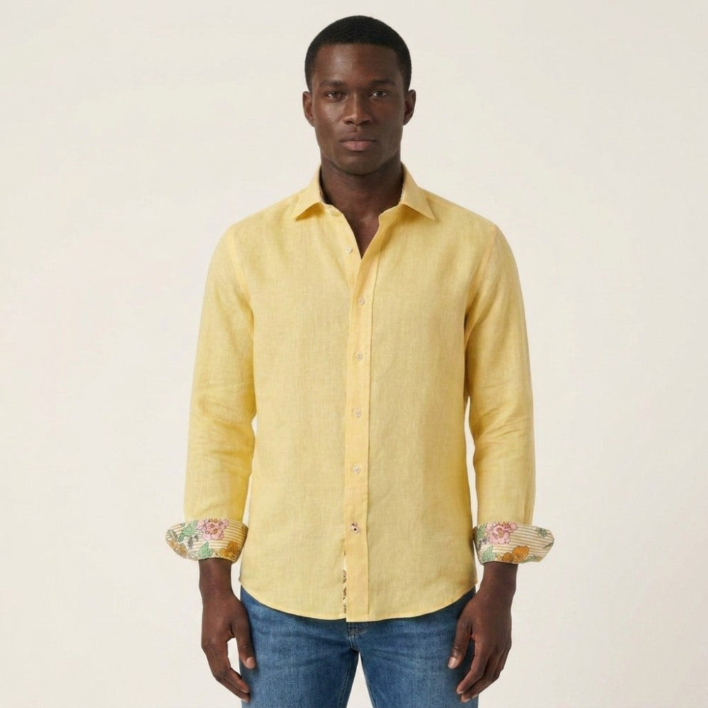 Yellow Andrea Bossi linen button-up long-sleeve shirt with a classic fit, shown on a hanger.